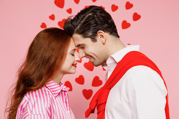 Young side view smiling lovely couple two friends woman man 20s wear casual shirt hug cuddle isolated on plain pastel pink background studio portrait. Valentine's Day birthday holiday party concept.