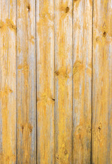 Fototapeta premium Old grey and yellow wooden background with cracks and scratches in vintage style