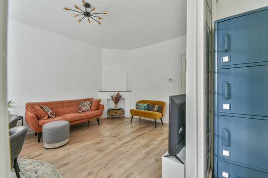 File cabinet and and bright couch in living room