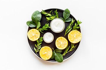 Beauty treatment with skin herbal cosmetic cream. Top view