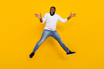 Fototapeta na wymiar Full length portrait of handsome excited person raise rams palms open mouth rejoice isolated on yellow color background