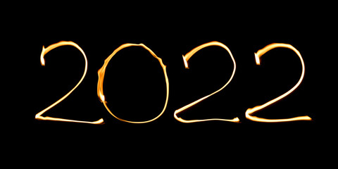 Burning text 2022 isolated on black background