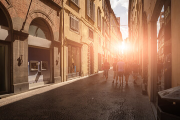 Lucca, Tuscany, Italy. August 2020. In a street of the historic center, bustle of people, beautiful...