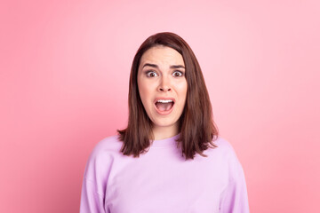 Photo of young girl stupor scared amazed shock fake news information isolated over pink color...