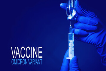 The concept of new generation vaccine against Coronavirus South African variant. Omicron variant of SARS-CoV-2. Vials of medication and syringe on a blue glass table with window background.