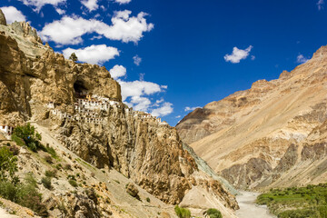 The ancient Tibetan Buddhist Phuktal monastery of on a steep rocky hillside in the Zanskar region in Ladakh in the Indian himalaya.