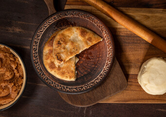  Prepared homemade pie with minced meat filling on the kitchen table