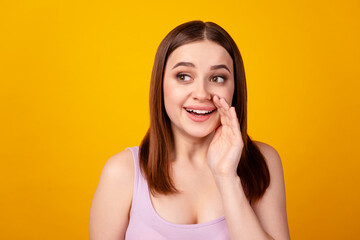 Photo of young lovely woman arm near mouth look empty space teel scream advert isolated over yellow color background