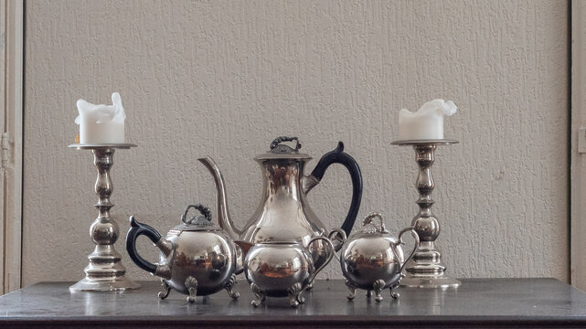 Classic set of tea pots on wooden table