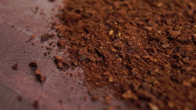 Soluble crushed dried chicory root on a wooden surface. Macro. Rotation. Healthy drink