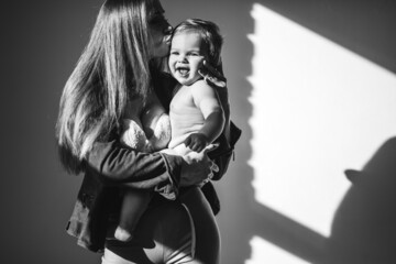 Young beautiful mother with her small child,practicing breast feeding
