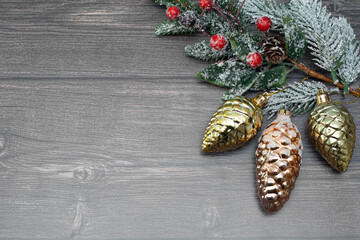 Christmas wooden background with a tet and a Christmas tree toy.