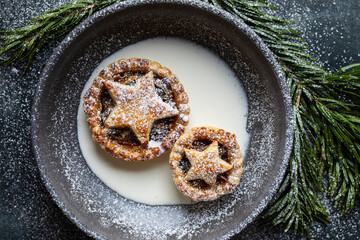 Home baked traditional Christmas mince pie with cream