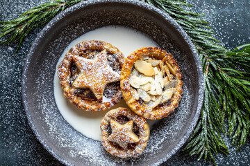 Home baked traditional Christmas mince pie with cream