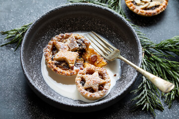 Home baked traditional Christmas mince pie with cream