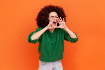 Attention, announcement! Side view portrait of woman with Afro hairstyle wearing green casual style...