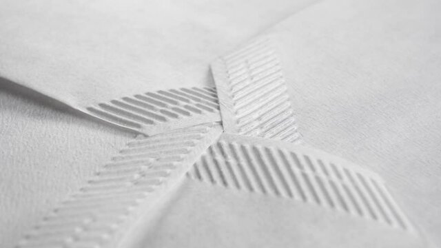 Corrugated white paper coffee soak bags. Blank tea ceremony accessory. Macro. Rotation