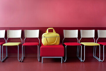 Corridor and waiting areas of a modern hospital with seating Yellow bag.