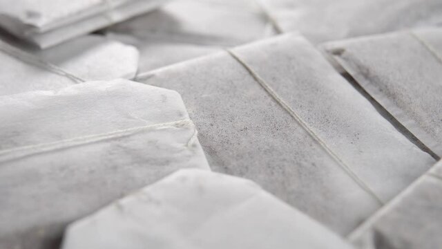 Paper bags with herbal tea. Macro. Rotation