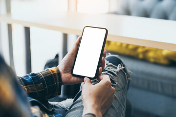 cell phone blank white screen mockup.hand holding texting using mobile on desk at office.background empty space for advertise.work people contact marketing business,technology