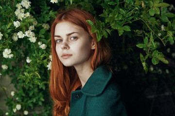 woman in green coat nature walk freedom fresh air