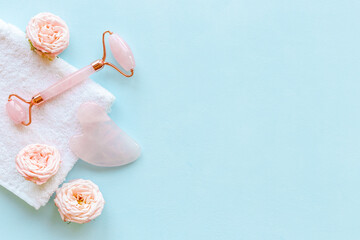 Massage stone roller with rose flowers for lifting face and wellness