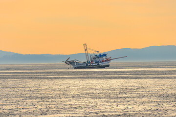 Anchored sea fishing boat. sunset and fishing boat. korea west sea. Ganghwa-gun, Incheon, Korea.