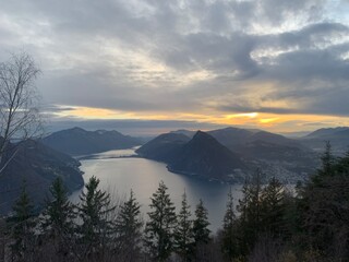 sunset over the city of lugano in switzerland as taken from mont bre