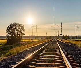 Plakat railroad tracks in the evening