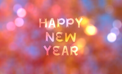 Happy New Year text festive defocused colorful blurred bokeh background.