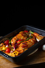 fried chicken legs with various vegetables