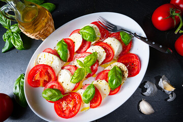 Tomato with mozzarella and basil