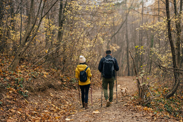 Confident caucasian couple, getting ready to challange the mountain.