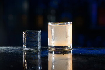beige refreshing coctail on a bar desk