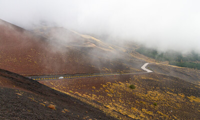 Asphalt road on the way to Etna mountain in Sicily, Italy.