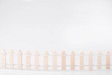 Small wooden fence on white background, Copy space