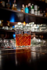 Cocktail Negroni with gin, campari martini rosso and orange. negroni cocktail at the bar
