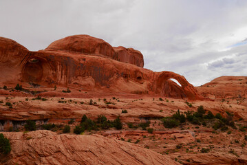 Corona Arch in the surroundings of Moab. Typical Utah landscape at sunset, red rock formations.