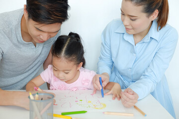 happy family asia drawing together in house