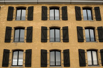 facade of yellow building with windows