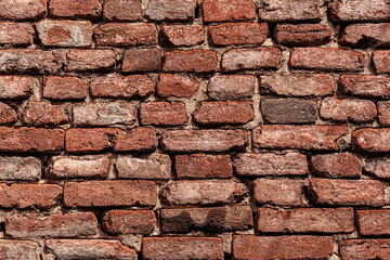 Old textured red brick masonry
