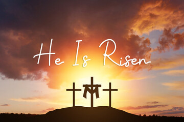 Sunday, He is risen. mount Calvaryand three silhouettes of crosses at sunrise., with text He is...