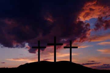 Silhouette jesus christ crucifix on cross on calvary sunset background concept for good friday he is risen in easter day