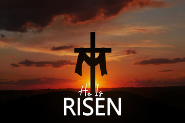 Saviour's cross on dramatic sunrise scene, with text He is risen