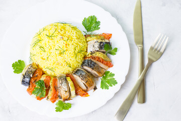Baked mackerel with vegetables. Ready-made seafood dish.