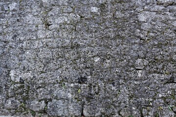 Old gray brick wall. Grunge brick wall. Background of old vintage brick wall.