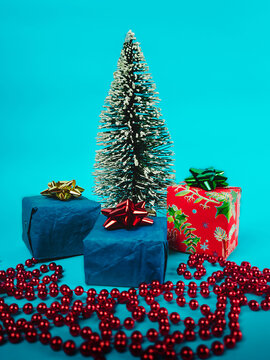 Christmas tree with gifts and decorations on a blue background