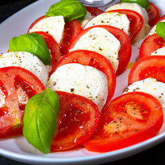 Tomato with mozzarella and basil