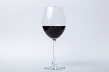 One glasses of red wine at wine tasting. Concept of red wine on colored background. Top view, flat lay design