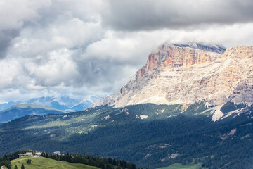 View of the cliff of the Italian Dolomites covered with low clouds